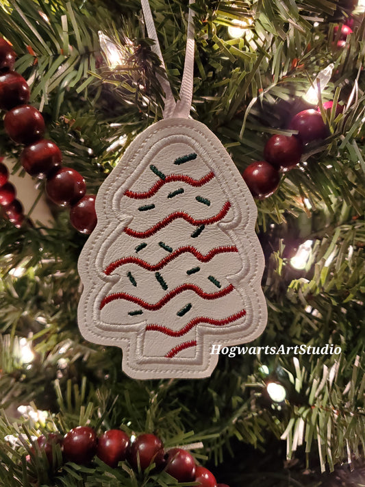 white snack cake ornament on tree