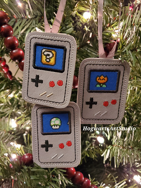 three game console ornaments on a tree