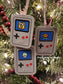 three game console ornaments on a tree