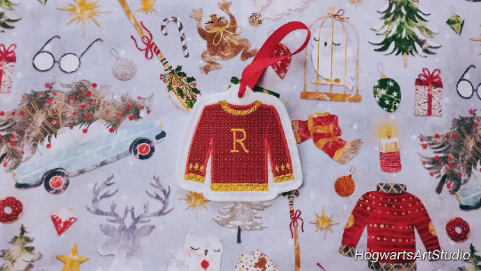 red sweater on a christmas themed background